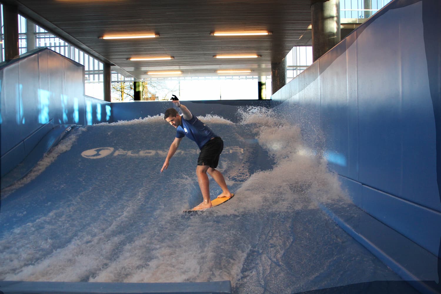 Person riding the wave at the aquarama flowrider attraction